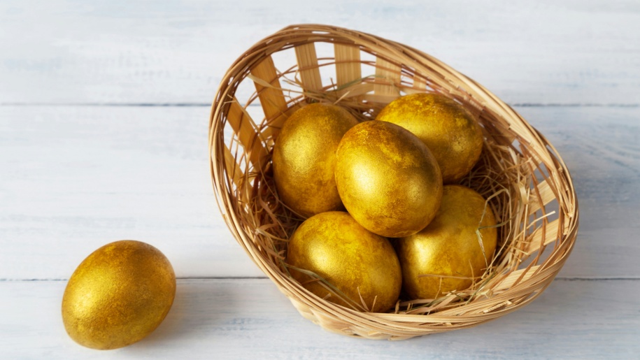 Golden eggs in a basket.