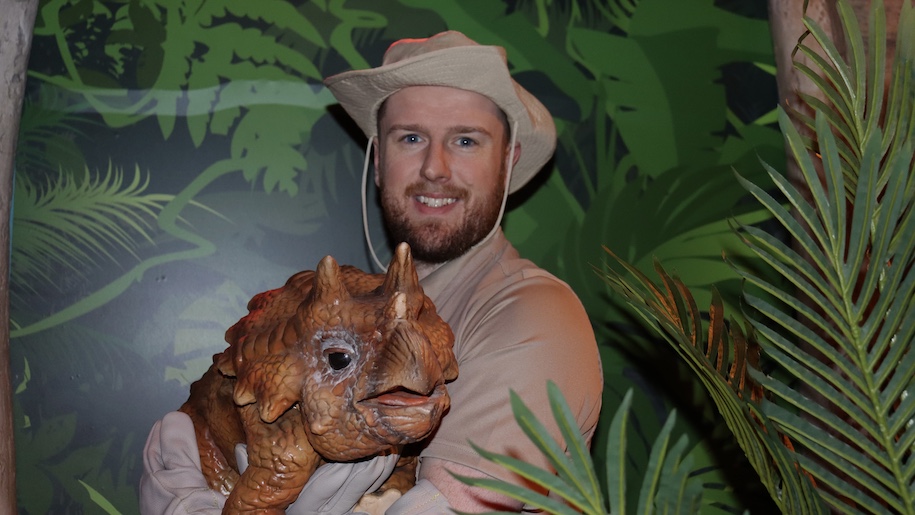 Dino puppet with man wearing hat at Sea Life Manchester