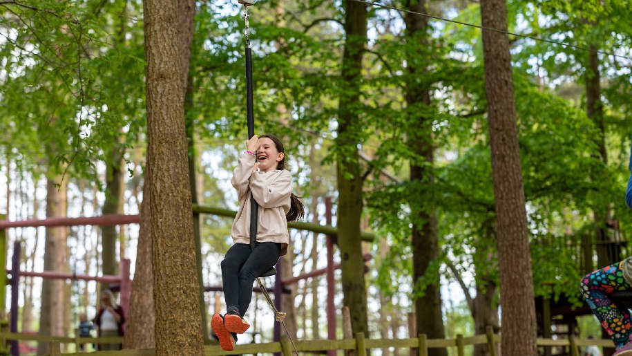 BeWILDerwood Norfolk girl swinging in trees