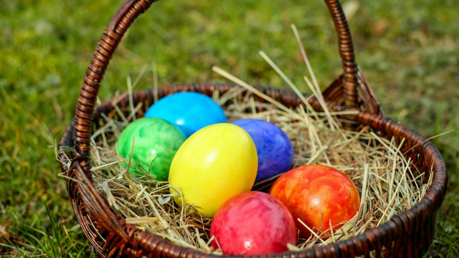 Coloured Easter eggs in a basket.