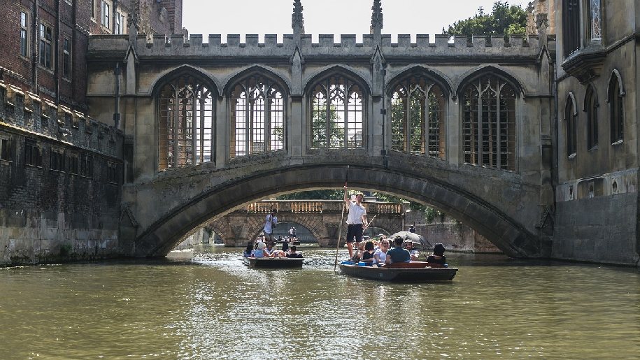 Punting through Cambridge under bridge