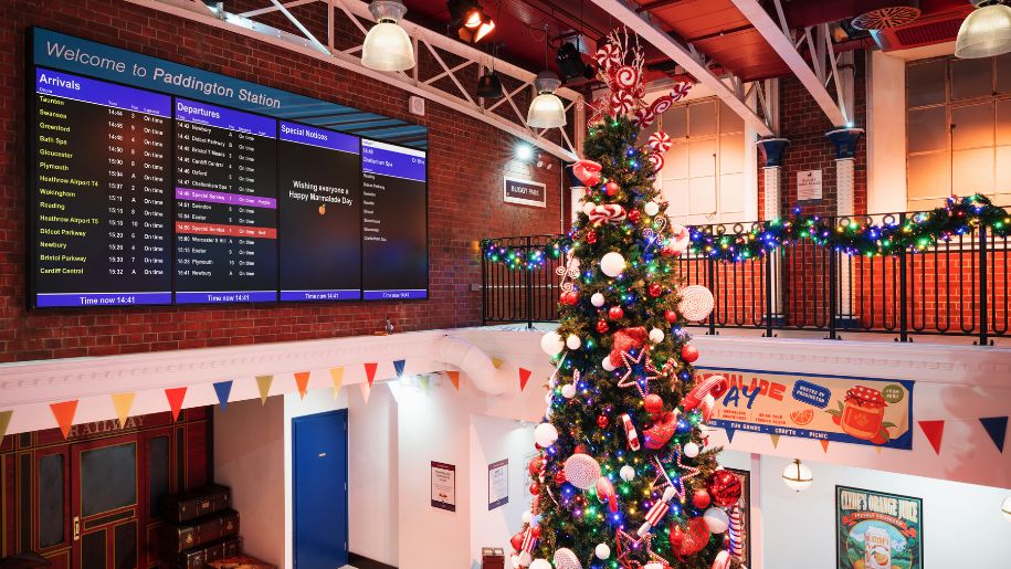 christmas tree in make believe train station concourse