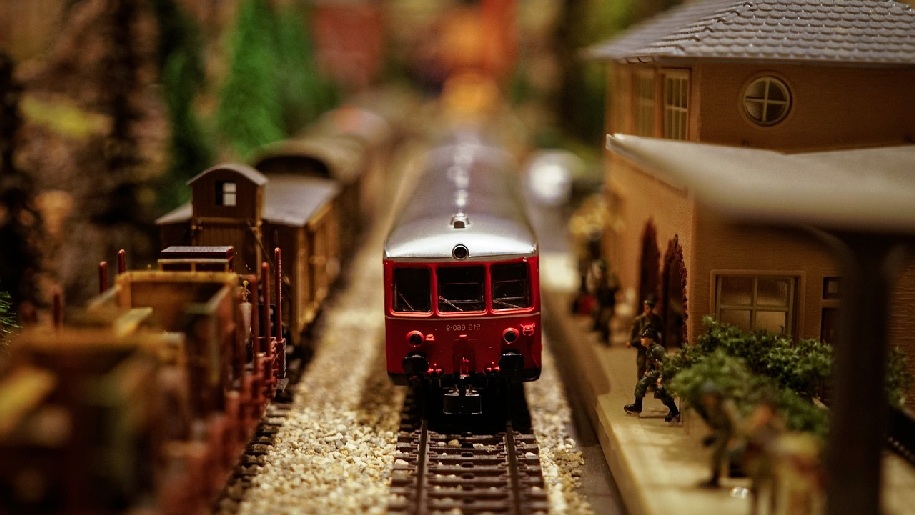 Generic model railway image of a train passing buildings