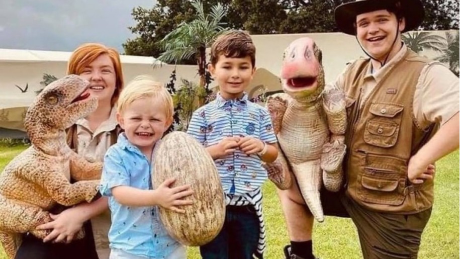 Family with a baby dinosaur and dinosaur egg at Hatton Adventure World.