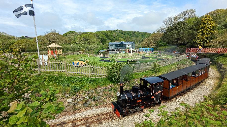 Lappa Valley in Cornwall train on track and amusements in the background