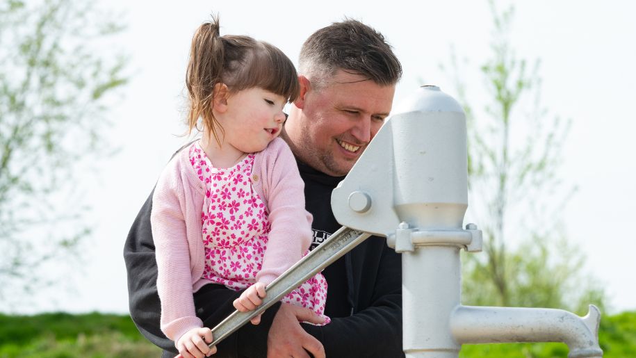 A father and daughter playing at Hogshaw Farm in Buckinghamshire.
