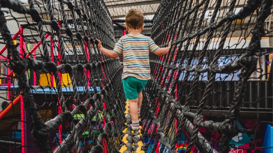 A child on a rope bridge.