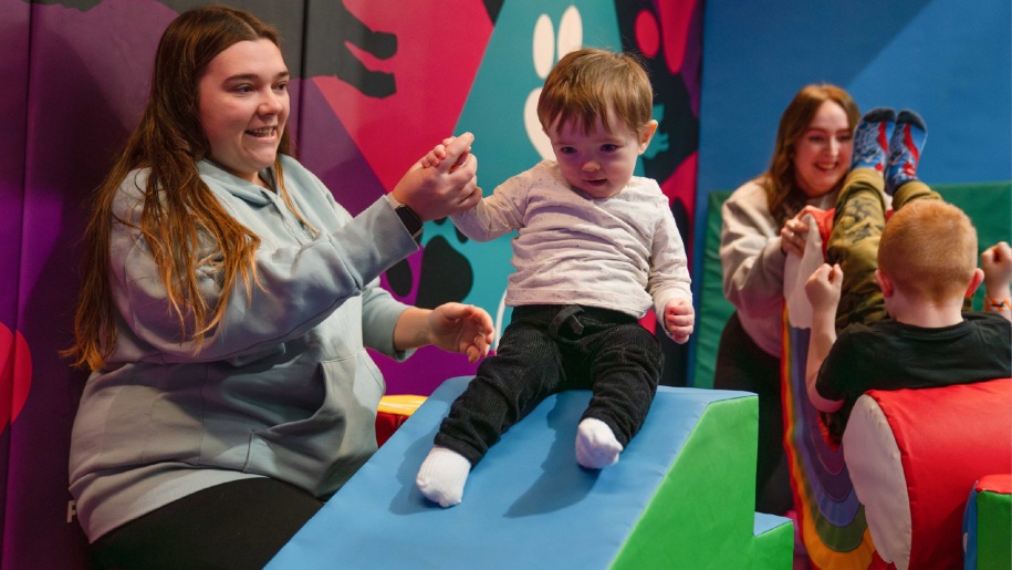 Adult and baby in the soft play area at Freedog Swindon.