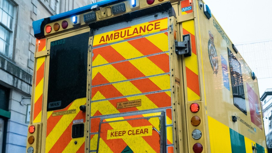 A yellow and orange ambulance.