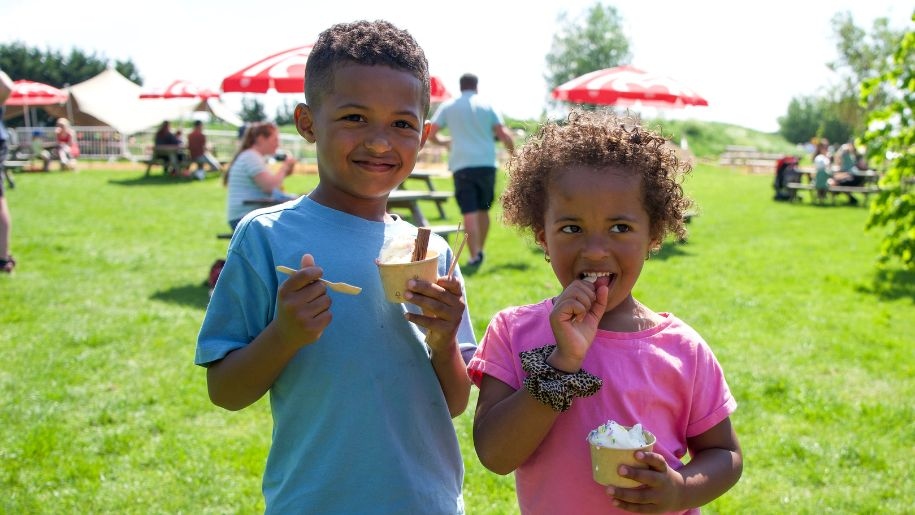 Children eating ice cream on a summer day out at Hogshaw Farm & Wildlife Park.