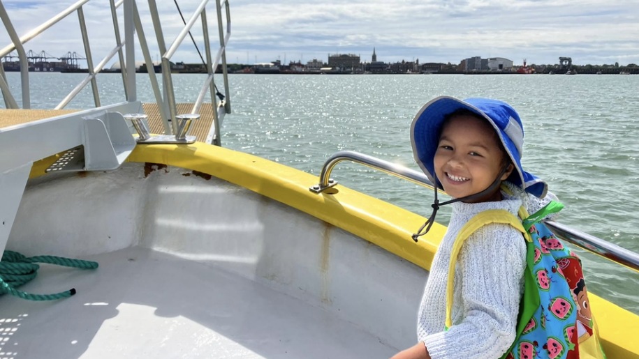 A child on a boat ride around Harwich Harbour.