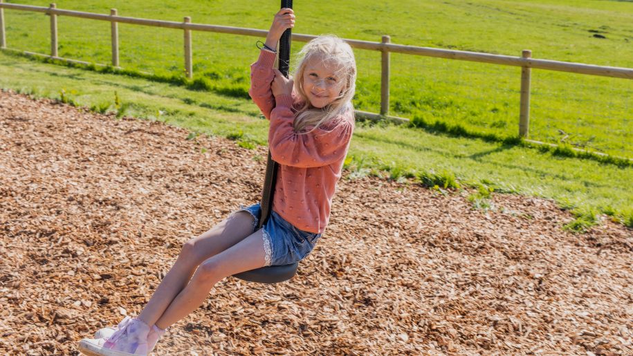 A child on the zip wire at Longdown Activity Farm.