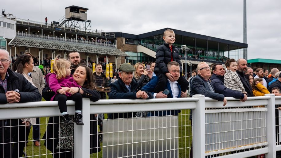 Spectators watching racing at Newcastle Racecourse in Tyne and Wear.