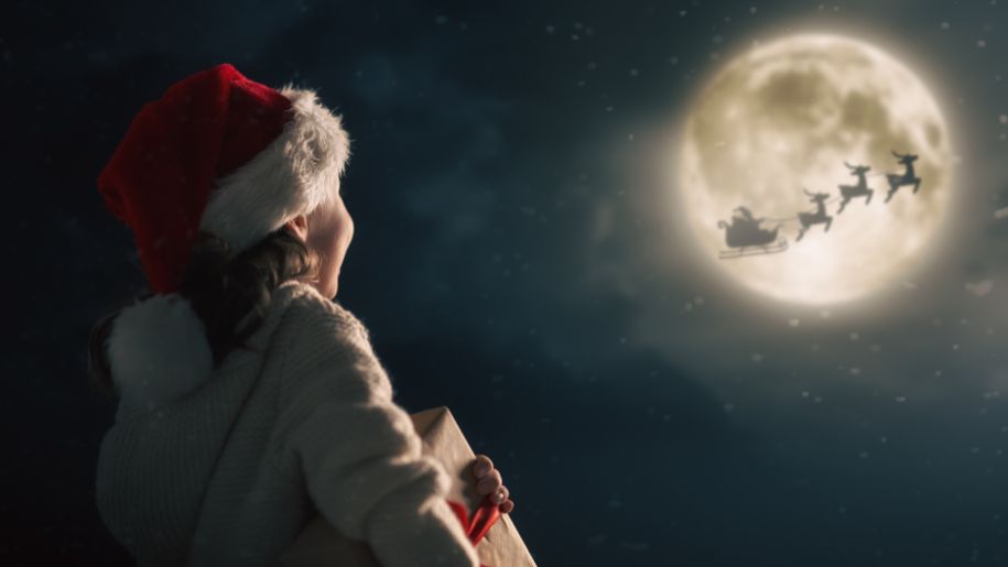 Shutterstock girl looking at moon Christmas