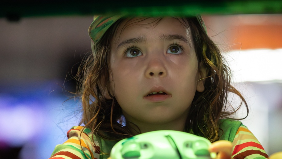 Child playing a videogame.