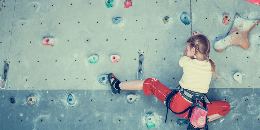 SHUTTERSTOCK girl on climbing wall