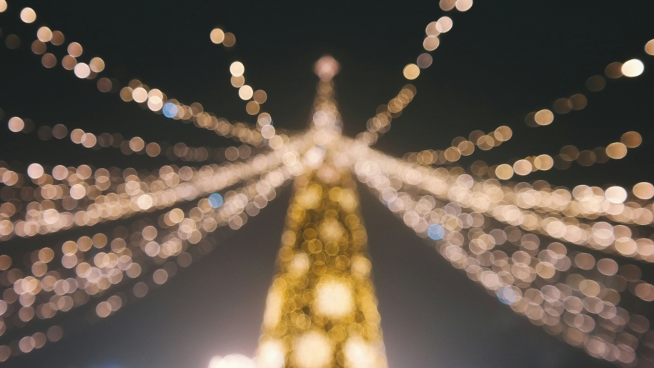 Christmas tree illuminated against the night sky.