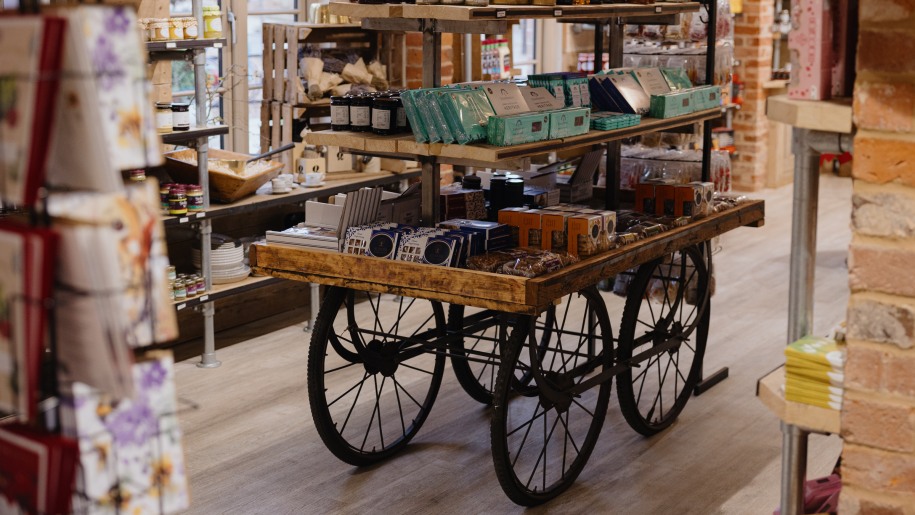 Produce displayed on an old cart in a farm shop.