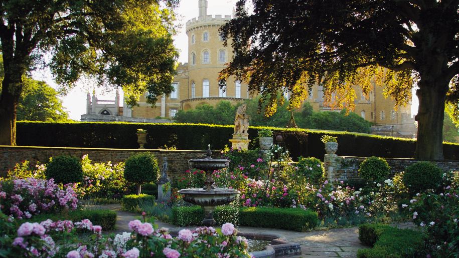 Rose gardens in summer with Belvoir Castle in the background.