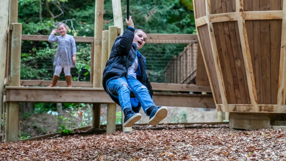 Child on the zip wire in the adventure playground at Belvoir Castle.