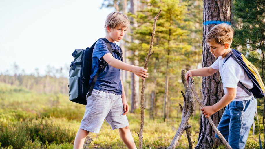 kids playing dens in wood