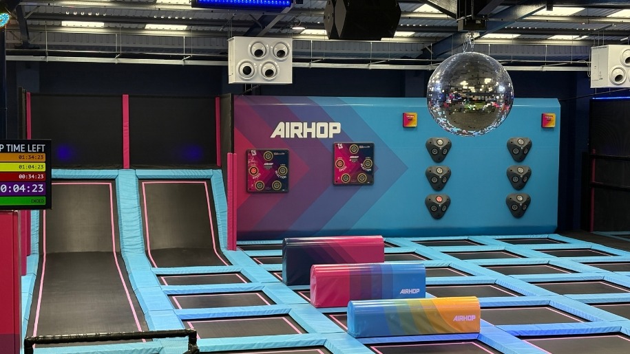 Brightly coloured trampoline attractions at AirHop Gloucester.
