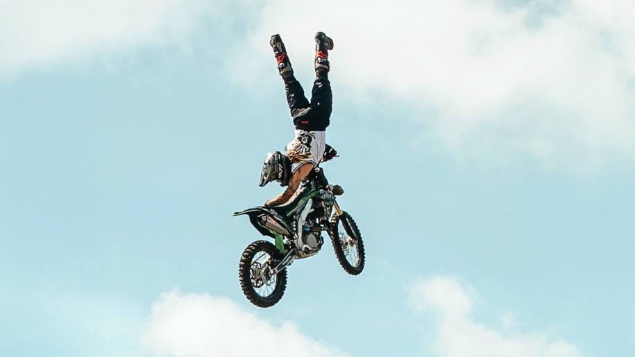 Motorcycle stunt rider in the air.