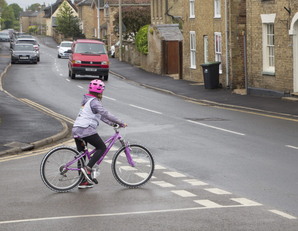 girl on bike on road