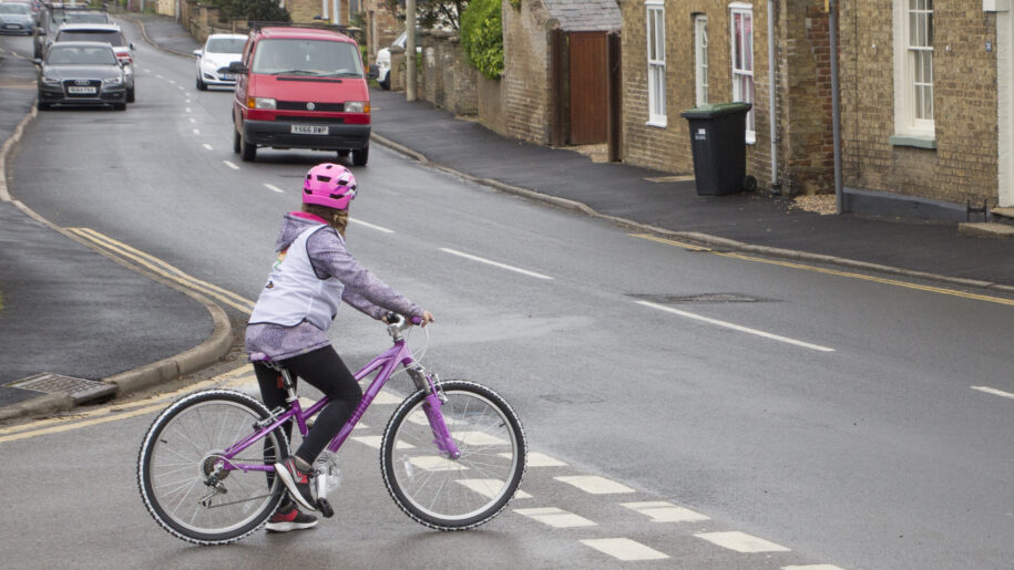 girl on bike on road