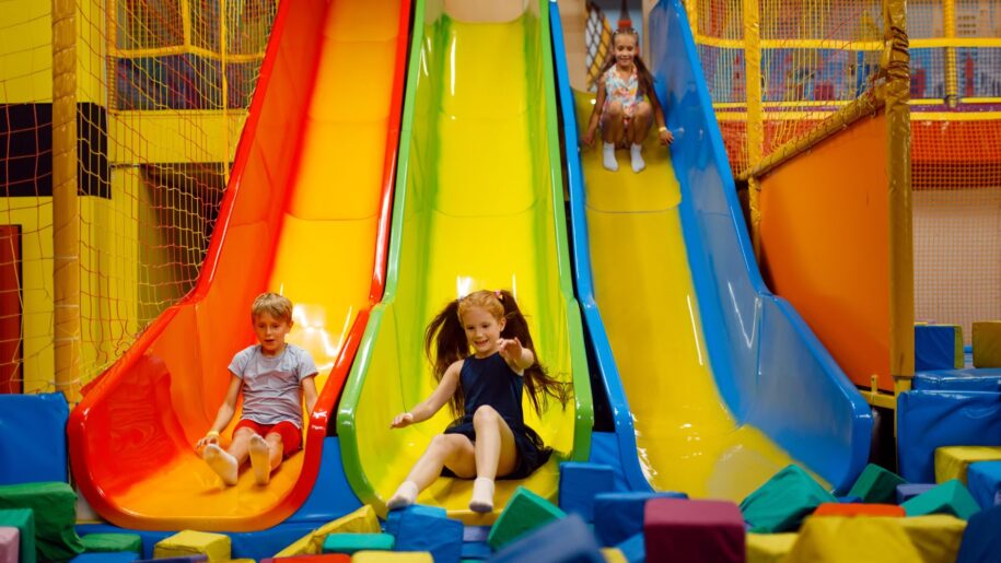 kids on soft play slide