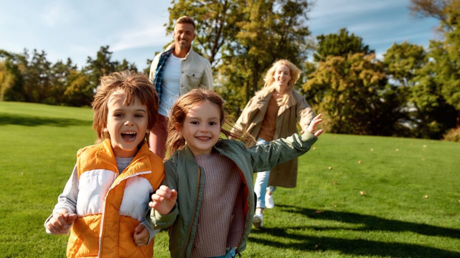 family run across sunny field