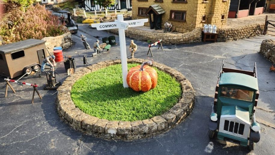 small car and roundabout with pumpkin on it