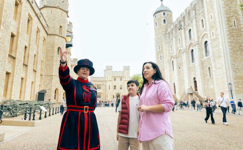 Photo of Tower of London Summer 2024 - Parade Ground showing Mother and son talking to Yeoman Warder. For full copyright information see Asset ID 74376.