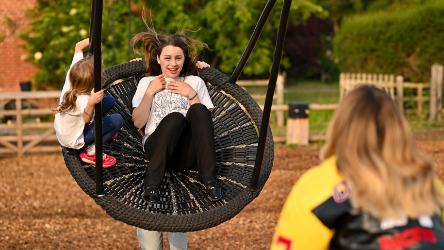 Girl in a swing.