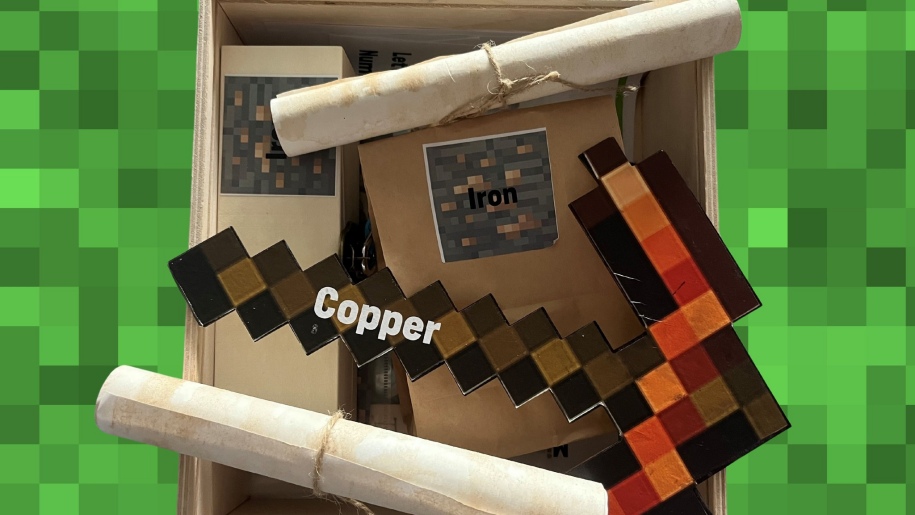 A wooden box with activities for Escape Room in a Box event.