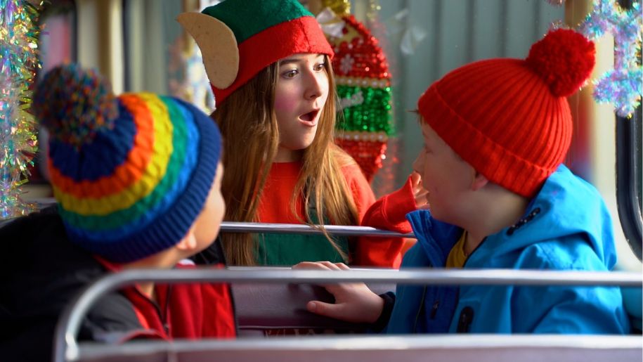 elf on a bus with two kids