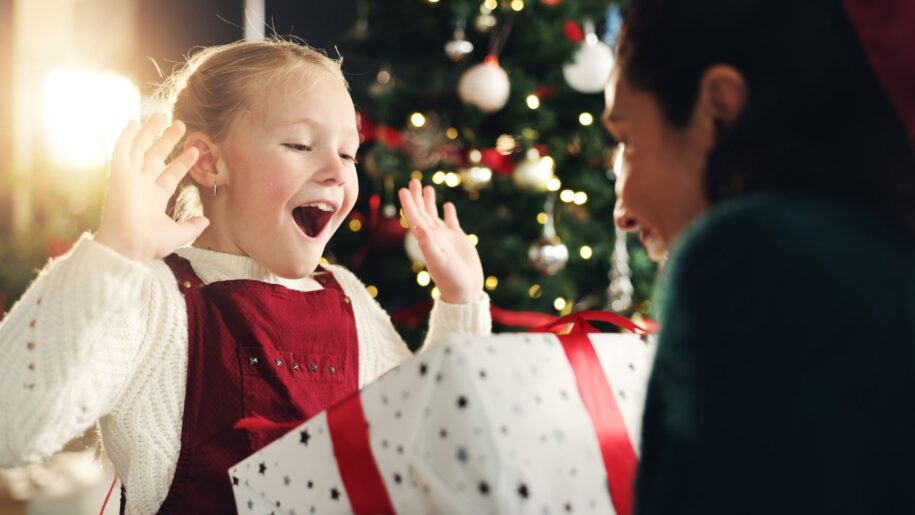 little girl happy with present