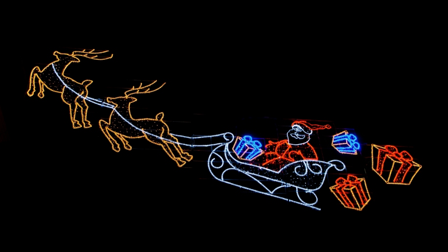 Christmas lights installation of Santa's sleigh pulled by two reindeer.