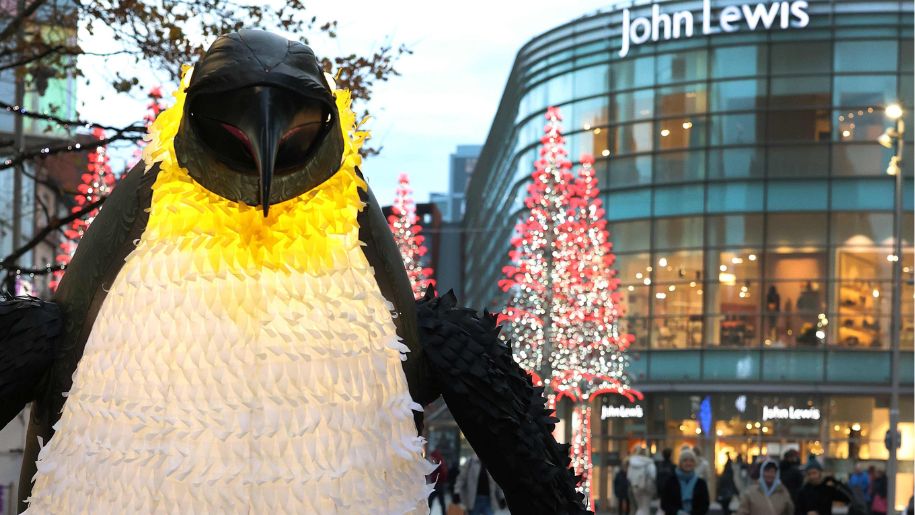giant penguin in front of shopping centre