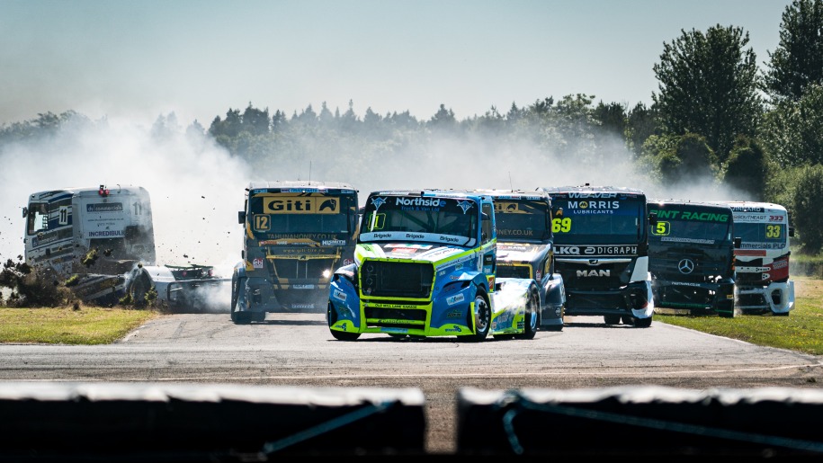 Trucks racing on a circuit.