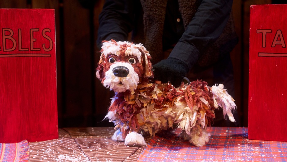 Puppet of a brown and white very scruffy puppy.