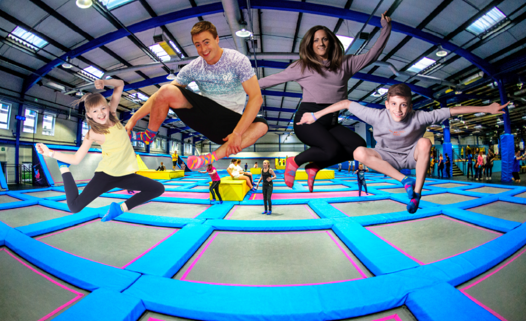 family jump on trampolines