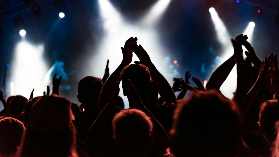 Audience clapping and cheering at a show or concert.