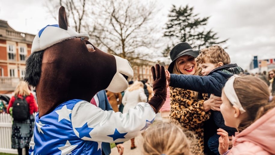 Ascot Racecourse's horse mascot greeting families.