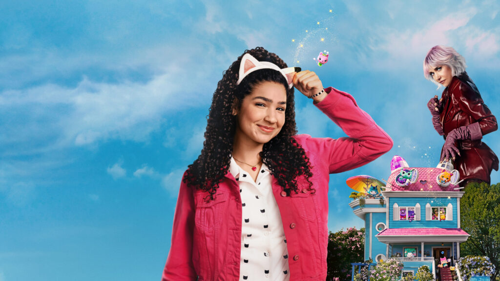 image of a girl with cat ears on, a pink jacket and a white top, with blue sky behind her