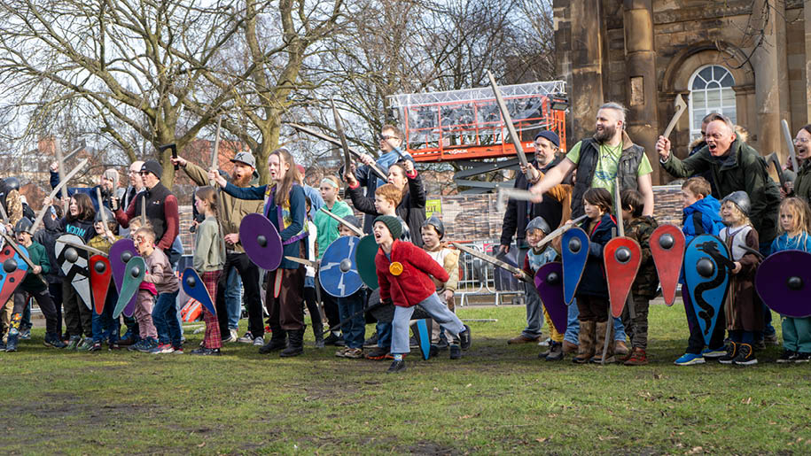 people dressed as vikings reinacting a battle