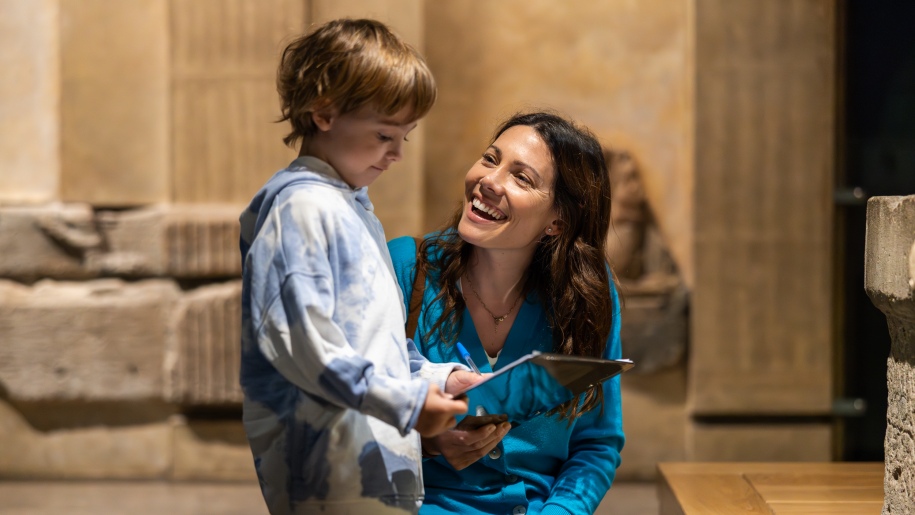 Mother and son following the family trail around The Roman Baths.