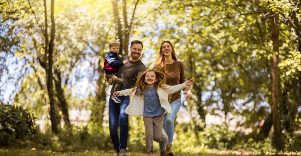 Family running through field