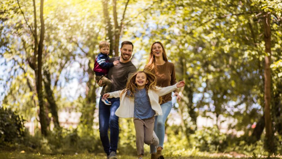 Family running through field