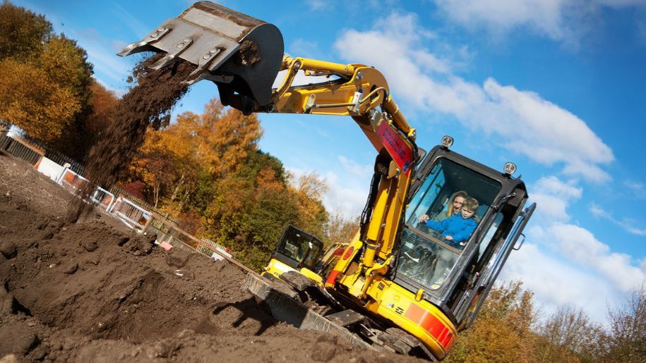 yellow digger in soil 